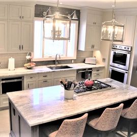 Remodeled white kitchen and marble